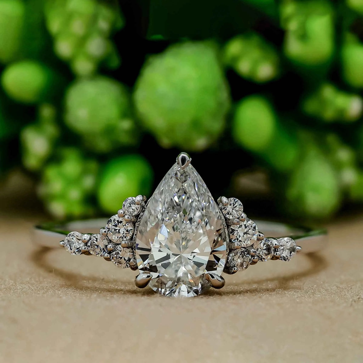 1 carat pear shaped moissanite cluster ring