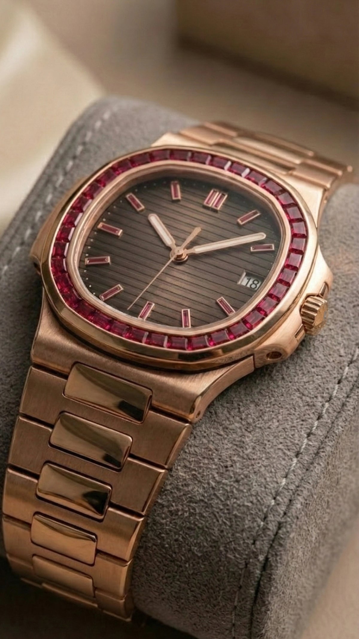Nautilus in rose gold with a baguette cut ruby watch