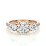 Load image into Gallery viewer, Front view of 2.50 Ct Round Moissanite Three Stone Engagement Ring In Rose Gold, highlighting the brilliant center moissanite stone.