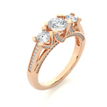 Load image into Gallery viewer, Angled view of 2 Ct Moissanite Three Stone Engagement Ring with Accent in Rose Gold, showcasing the band and setting.