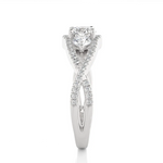 Load image into Gallery viewer, Side profile of 2 Carat Round Moissanite Three Stone Twisted Engagement Ring in White Gold, highlighting the brilliant center moissanite stone, highlighting the prong setting.
