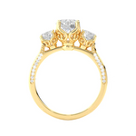 Load image into Gallery viewer, Side profile of 2 Carat Round Moissanite Filigree Three Stone Engagement Ring in Yellow Gold, highlighting the prong setting.