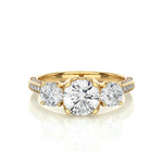 Load image into Gallery viewer, Front view of 2 Carat Round Moissanite Filigree Three Stone Engagement Ring in Yellow Gold, highlighting the brilliant center moissanite stone.