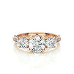 Load image into Gallery viewer, Front view of 2 Ct Round Moissanite Filigree Three Stone Engagement Ring in Rose Gold, highlighting the brilliant center moissanite stone.