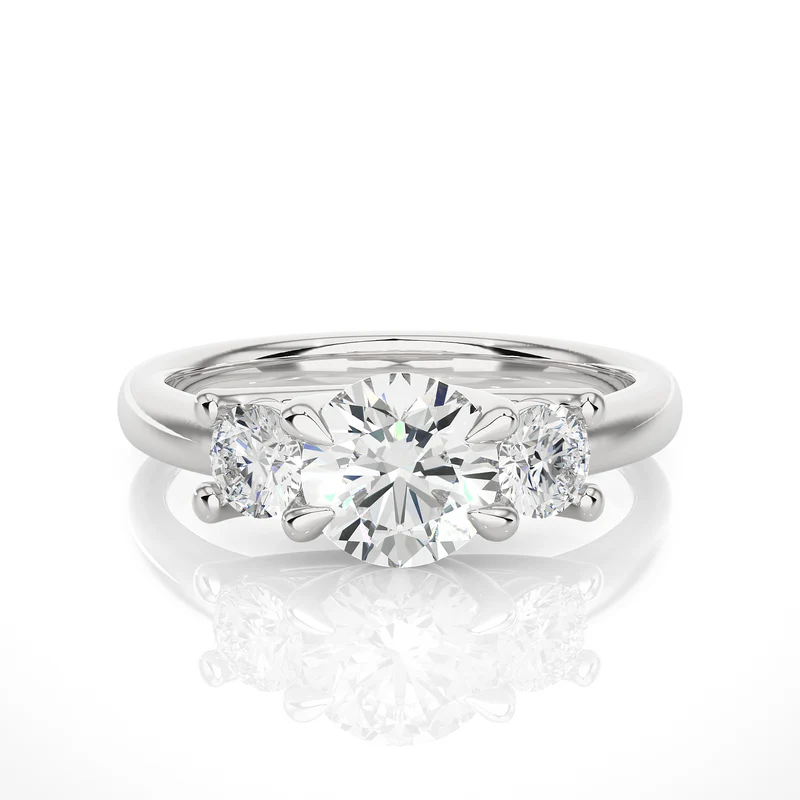 Front view of 2 carat round moissanite three stone engagement ring in white gold, highlighting the brilliant center moissanite stone