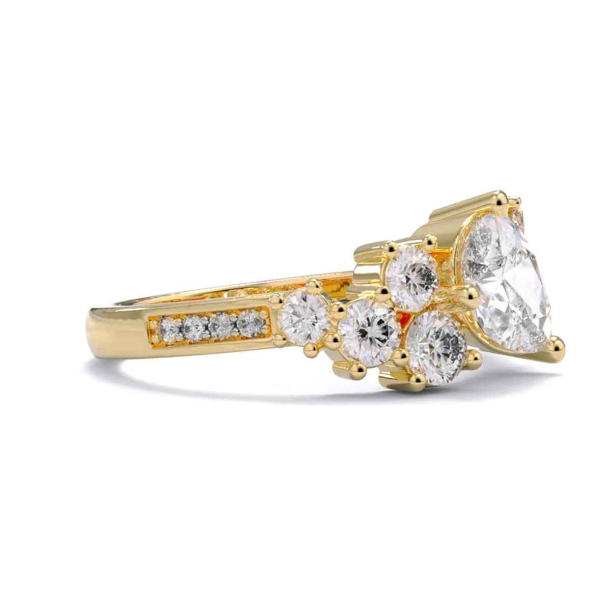 2 carat pear and round shape moissanite cluster ring in yellow gold