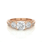 Load image into Gallery viewer, Front view of 2 Carat Moissanite Three Stone Engagement Ring With Accents in Rose Gold, highlighting the brilliant center moissanite stone.