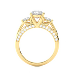 Load image into Gallery viewer, Side profile of 12 Carat Moissanite Three Stone Engagement Ring With Accents in Yellow Gold, highlighting the prong setting.