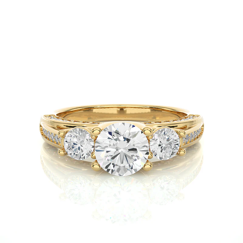 Front view of 2 carat moissanite three stone engagement ring with accents in yellow gold, highlighting the brilliant center moissanite stone