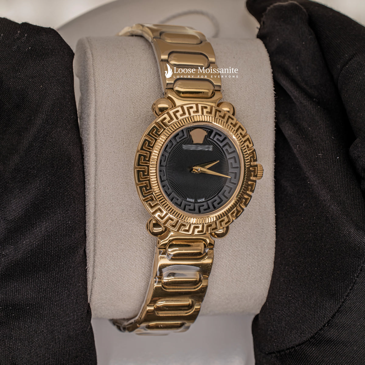 Side view of greca twist black dial analogue watch for women