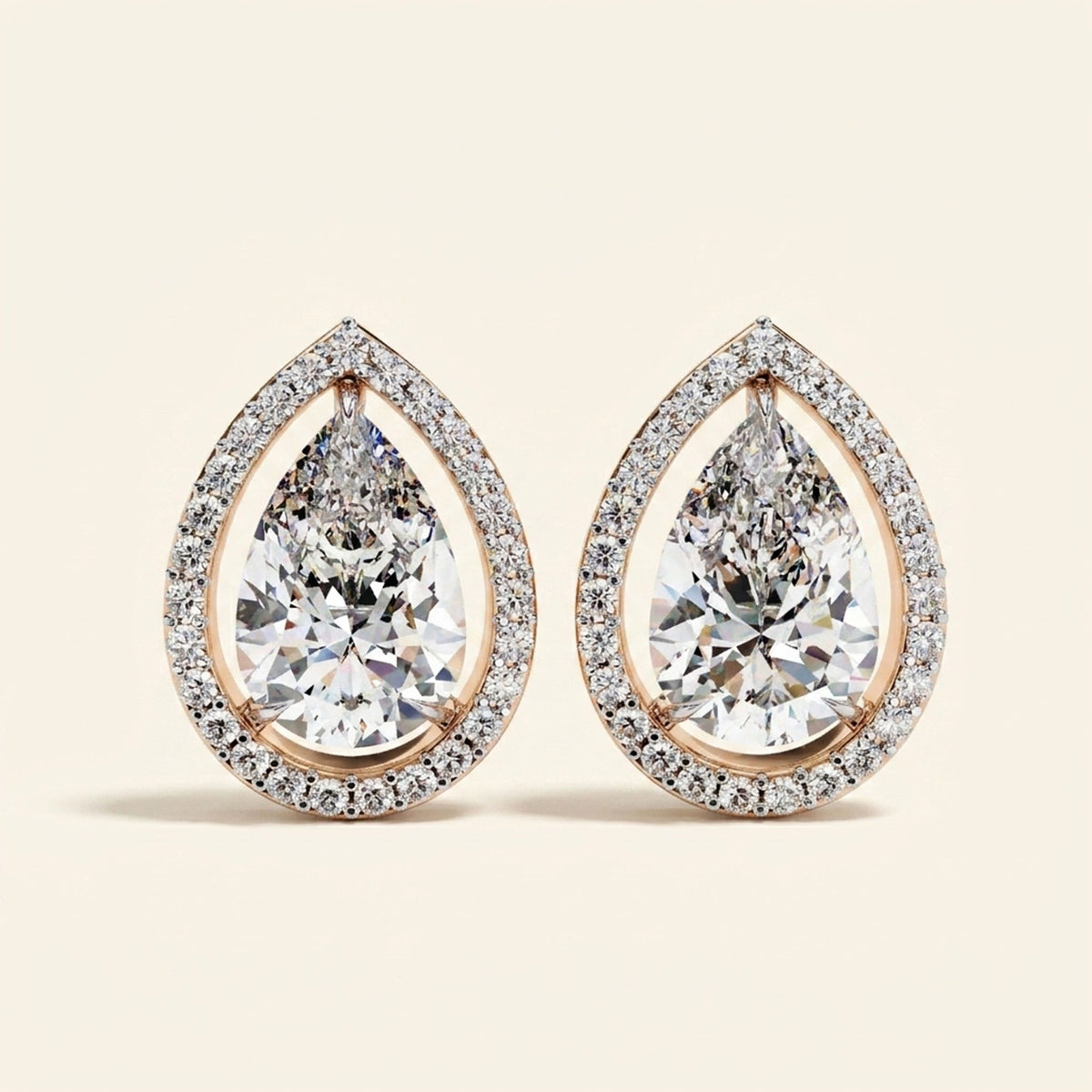 Front view of pear halo stud earrings