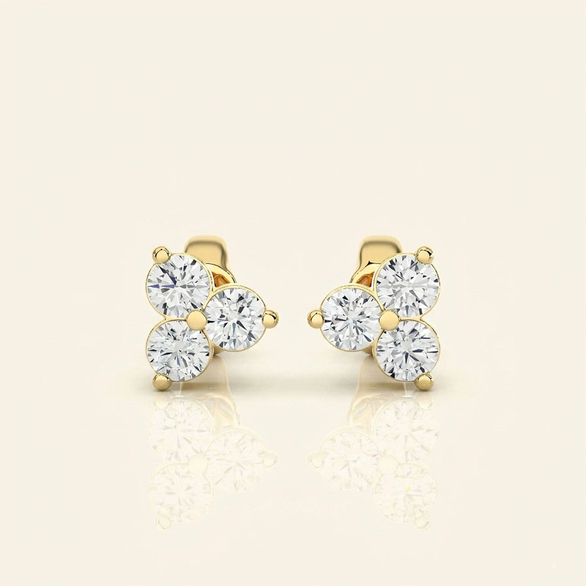 Front view of three stone stud earrings