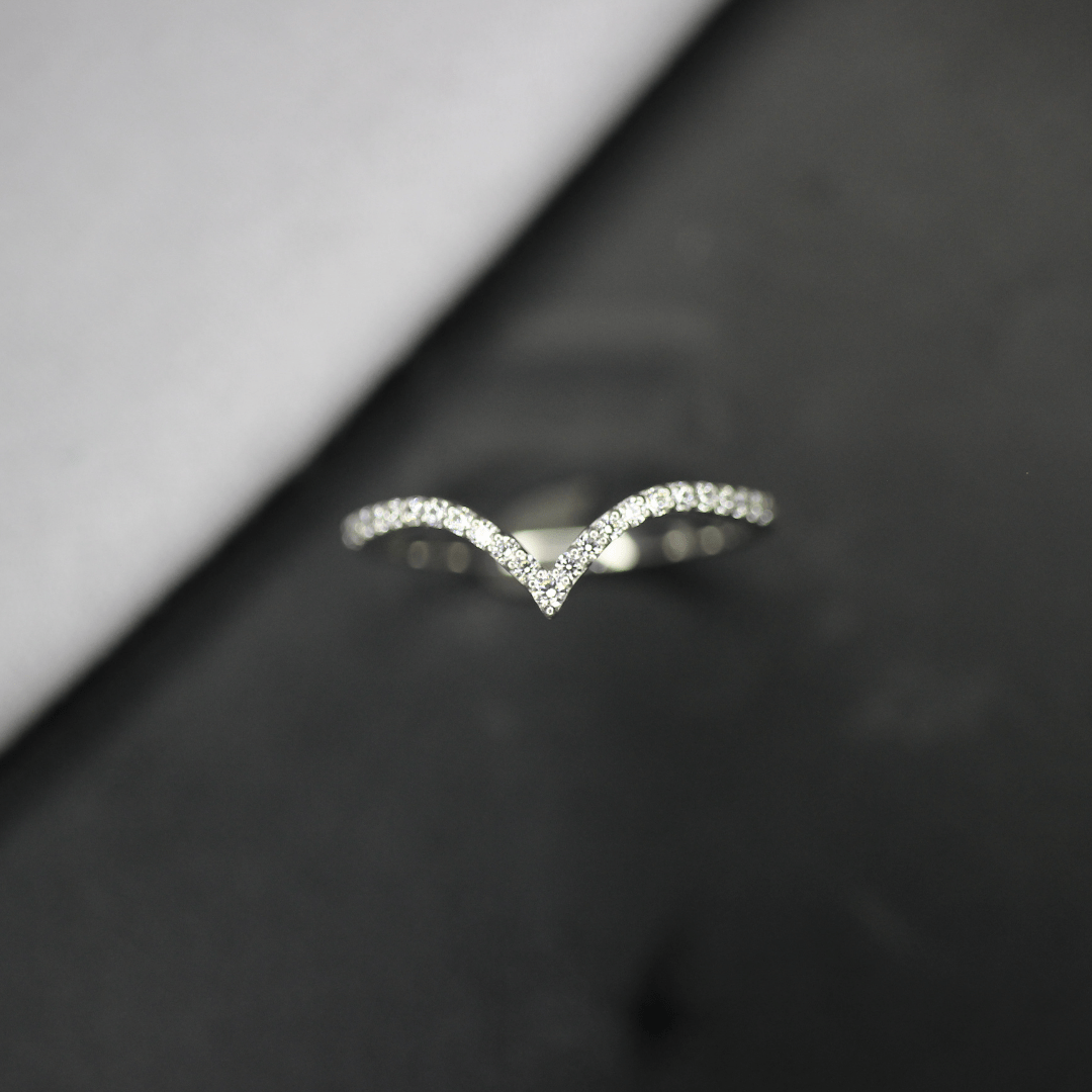 Curved moissanite wedding band
