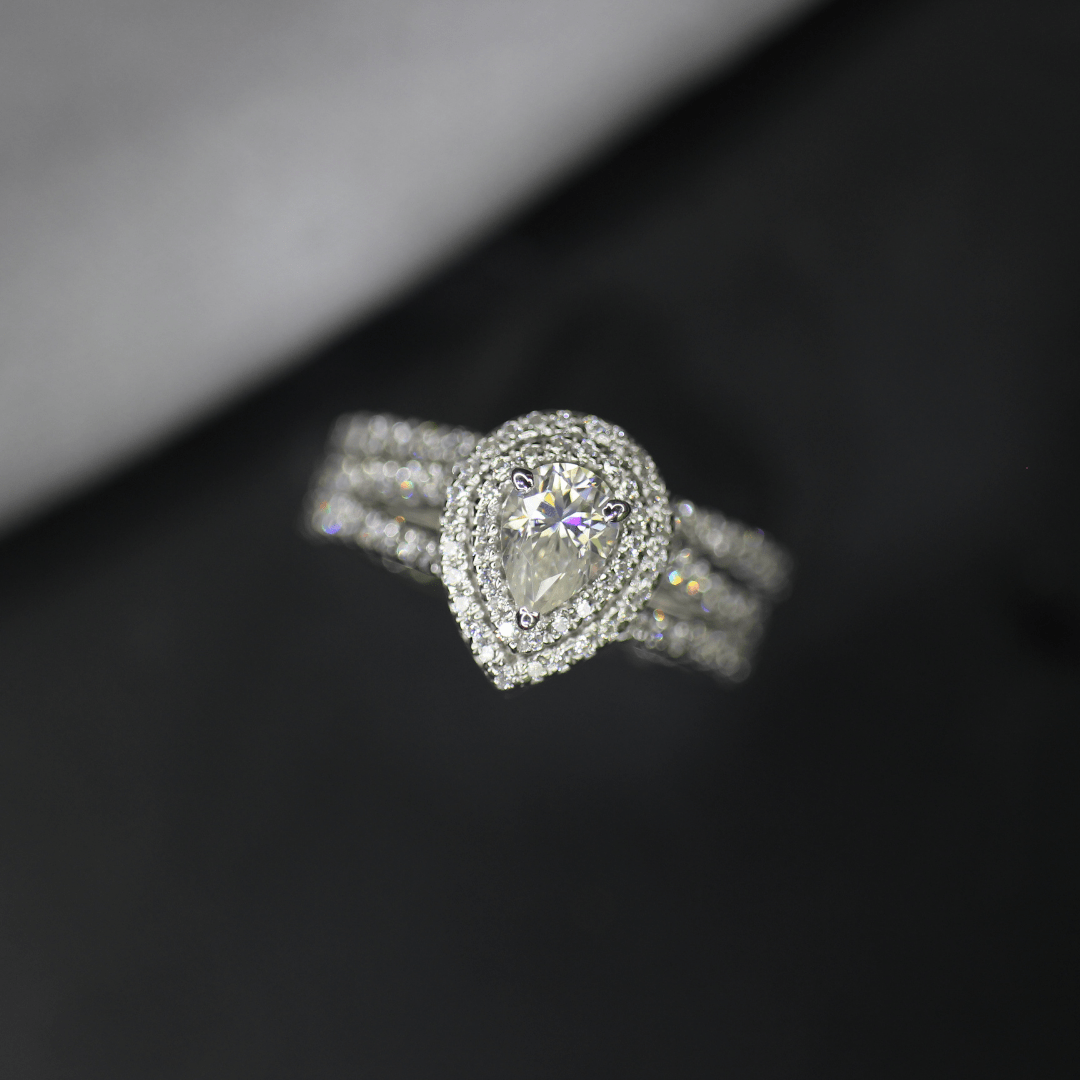 Pear halo moissanite engagement ring