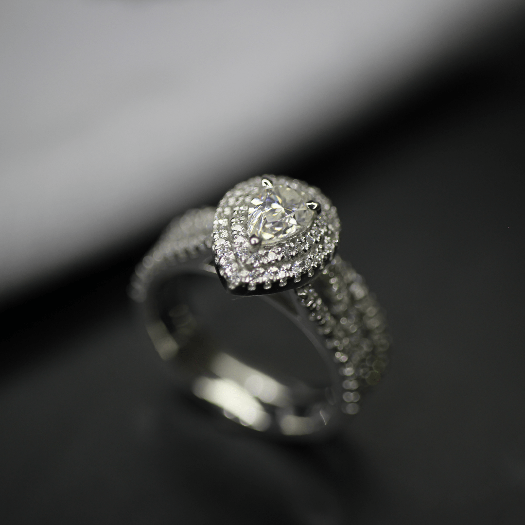 Pear halo moissanite engagement ring
