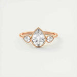 Load image into Gallery viewer, 2 Carat Pear Cut Three Stone Bezel Set Moissanite Ring in Rose Gold