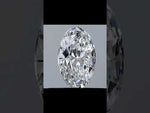 Load and play video in Gallery viewer, Rotating view of an oval cut moissanite gemstone, showcasing its brilliant sparkle, symmetrical shape, and faceted design.
