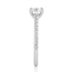 Load image into Gallery viewer, Side profile of 1.20 Ct Round Cut Moissanite Cathedral Set Engagement Ring In Silver, highlighting the brilliant center moissanite stone., highlighting the prong setting.