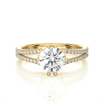 Load image into Gallery viewer, Front view of 1.40 Ct Round Cut Moissanite Split Shank Engagement Ring In Yellow Gold, highlighting the brilliant center moissanite stone.