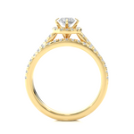 Load image into Gallery viewer, Side profile of 1.50 Carat Halo Moissanite Bridal Set With Accents in Yellow Gold, highlighting the brilliant center moissanite stone., highlighting the prong setting.
