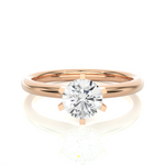 Load image into Gallery viewer, Front view of 1.50 Carat Round Cut Moissanite Solitaire Engagement Ring In Rose Gold, highlighting the brilliant center moissanite stone.