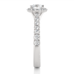 Load image into Gallery viewer, Side profile of 1.50 Carat Round Moissanite Halo Engagement Ring In Silver, highlighting the brilliant center moissanite stone., highlighting the prong setting.