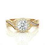 Load image into Gallery viewer, Front view of 1.50 Carat Round Moissanite Halo Twisted Ring In Yellow Gold, highlighting the brilliant center Moissanite stone.