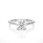 Load image into Gallery viewer, Front view of 1.50 Ct Round Moissanite Hidden Halo Engagement Ring In White Gold, highlighting the brilliant center Moissanite stone.