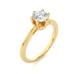 Load image into Gallery viewer, Angled view of 1.50 Ct Round Moissanite Solitaire Engagement Ring In Yellow Gold, showcasing the band and setting.​
