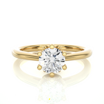 Load image into Gallery viewer, Front view of 1.50 Ct Round Moissanite Solitaire Engagement Ring In Yellow Gold, highlighting the brilliant center moissanite stone.