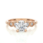 Load image into Gallery viewer, Front view of 1.50 Ct Round Shape Moissanite Five Stone Engagement Ring In Rose Gold, highlighting the brilliant center Moissanite stone.