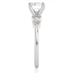 Load image into Gallery viewer, Side profile of 1.50 Ct Round cut Moissanite Five Stone Engagement Ring In Silver, highlighting the brilliant center moissanite stone., highlighting the prong setting.