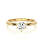 Load image into Gallery viewer, Front view of 1 Carat Round Cut Solitaire Moissanite Ring in Yellow Gold, highlighting the brilliant center moissanite stone.