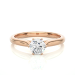 Load image into Gallery viewer, Front view of 1 Carat Round Moissanite Solitaire Engagement Ring In Rose Gold, highlighting the brilliant center moissanite stone.