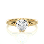 Load image into Gallery viewer, Front view of 1 Carat Round Moissanite Split Shank Solitaire Engagement Ring In Yellow Gold, highlighting the brilliant center moissanite stone.