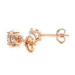 Load image into Gallery viewer, Angled view of 1 Ct Basket Set Moissanite Stud Earrings In Rose Gold, showing depth and radiant sparkle.