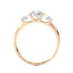 Load image into Gallery viewer, Side profile of 2 Carat Round Cut Moissanite Three Stone Engagement Ring In Rose Gold, highlighting the brilliant center moissanite stone., highlighting the prong setting.