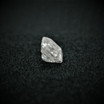 Load image into Gallery viewer, Side view of the emerald cut moissanite—sharp lines, elegant shape, and a brilliant shine from every angle.