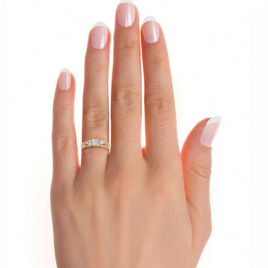 1 carat princess and round moissanite three stone ring in yellow gold