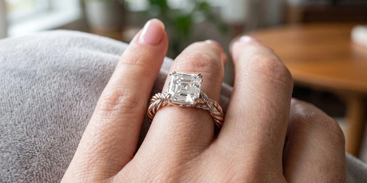 Asscher cut solitaire ring with interwoven twisted metal bands