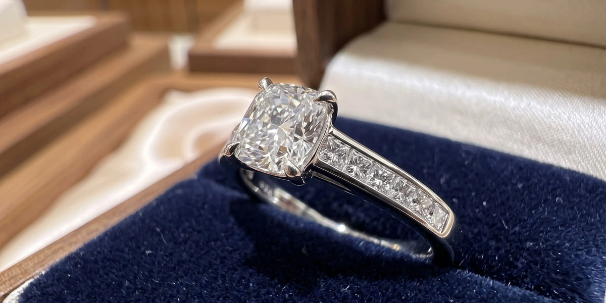 Cushion cut solitaire accent ring with princess cut channel accents: classic elegance with contemporary brilliance