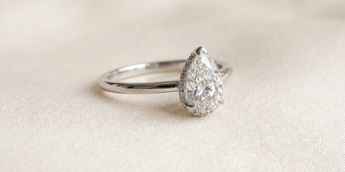 pear solitaire ring with delicate under halo detail