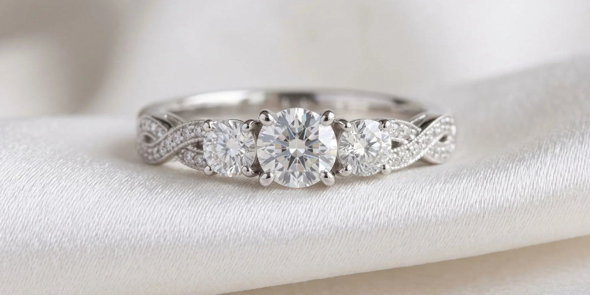 Endless sparkle, timeless love: round 3 stone ring with interlocking continuous accent stones