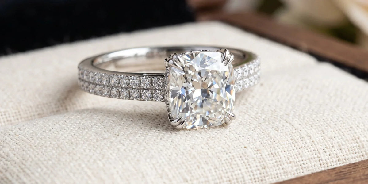 Cushion solitaire accent ring with a double row pavé band