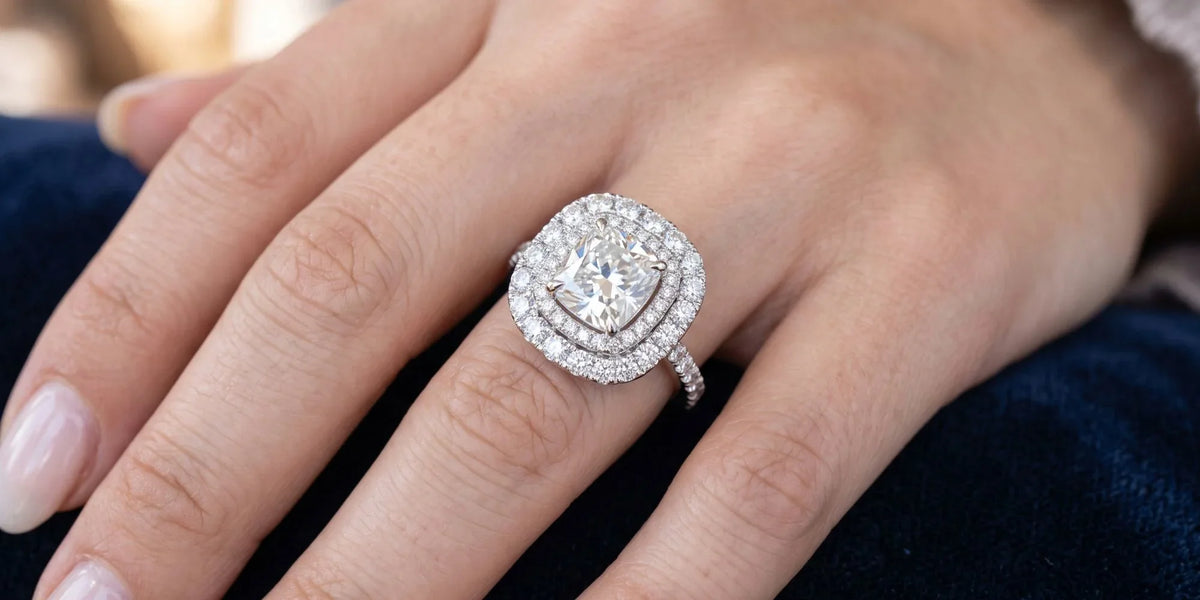 Cushion double halo ring with concentric tiered framing