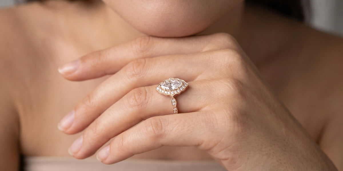 Marquise cut halo engagement ring with elevated wirework bridge: a graceful fusion of vintage charm and modern brilliance