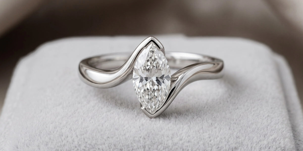 Marquise solitaire ring with elegant tensioned flow: a graceful fusion of movement and sophistication