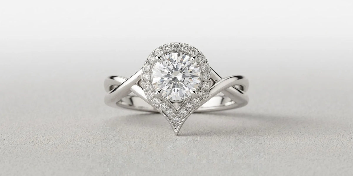 Round halo ring with a sculpted chevron gallery