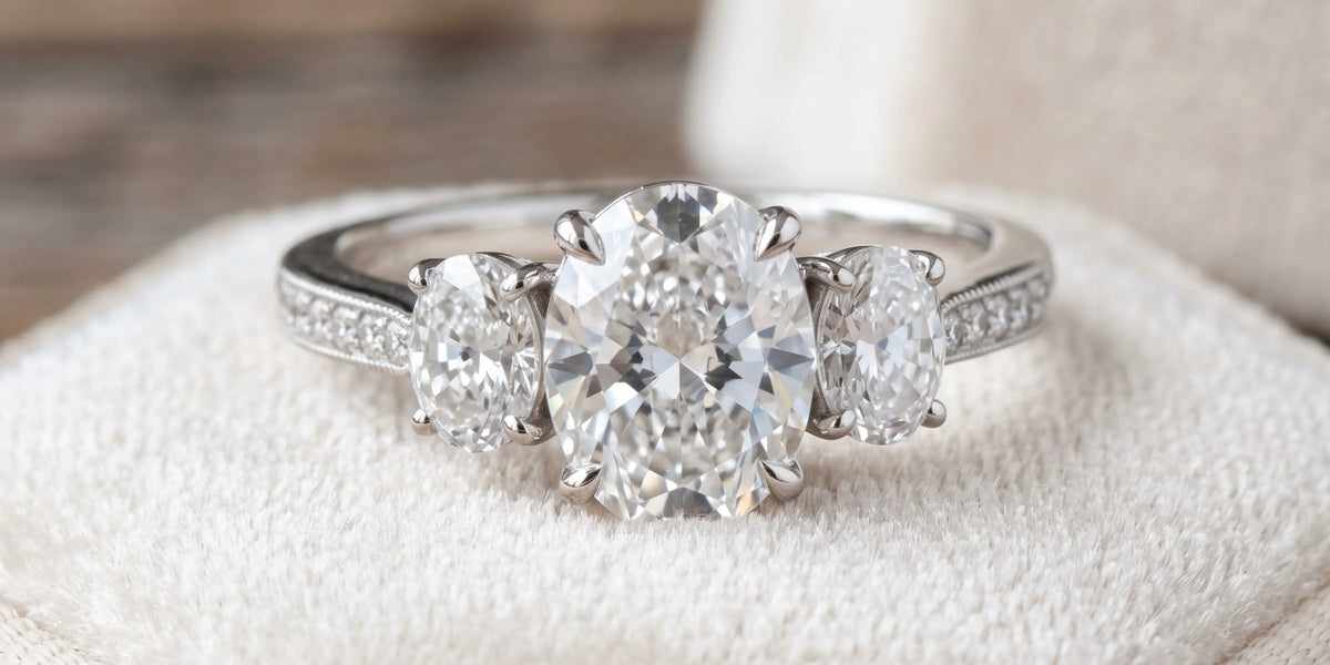 Oval three stone ring with graduated side stones: a timeless symbol of love and elegance