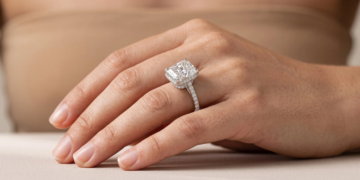Radiant cut hidden halo engagement ring with double tiered moissanite scarf